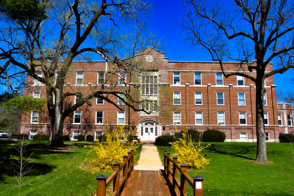 Wide shot of Stoddard Hall and the bridge that connects it with Hudson Hall. The picture was taken in the Fall.