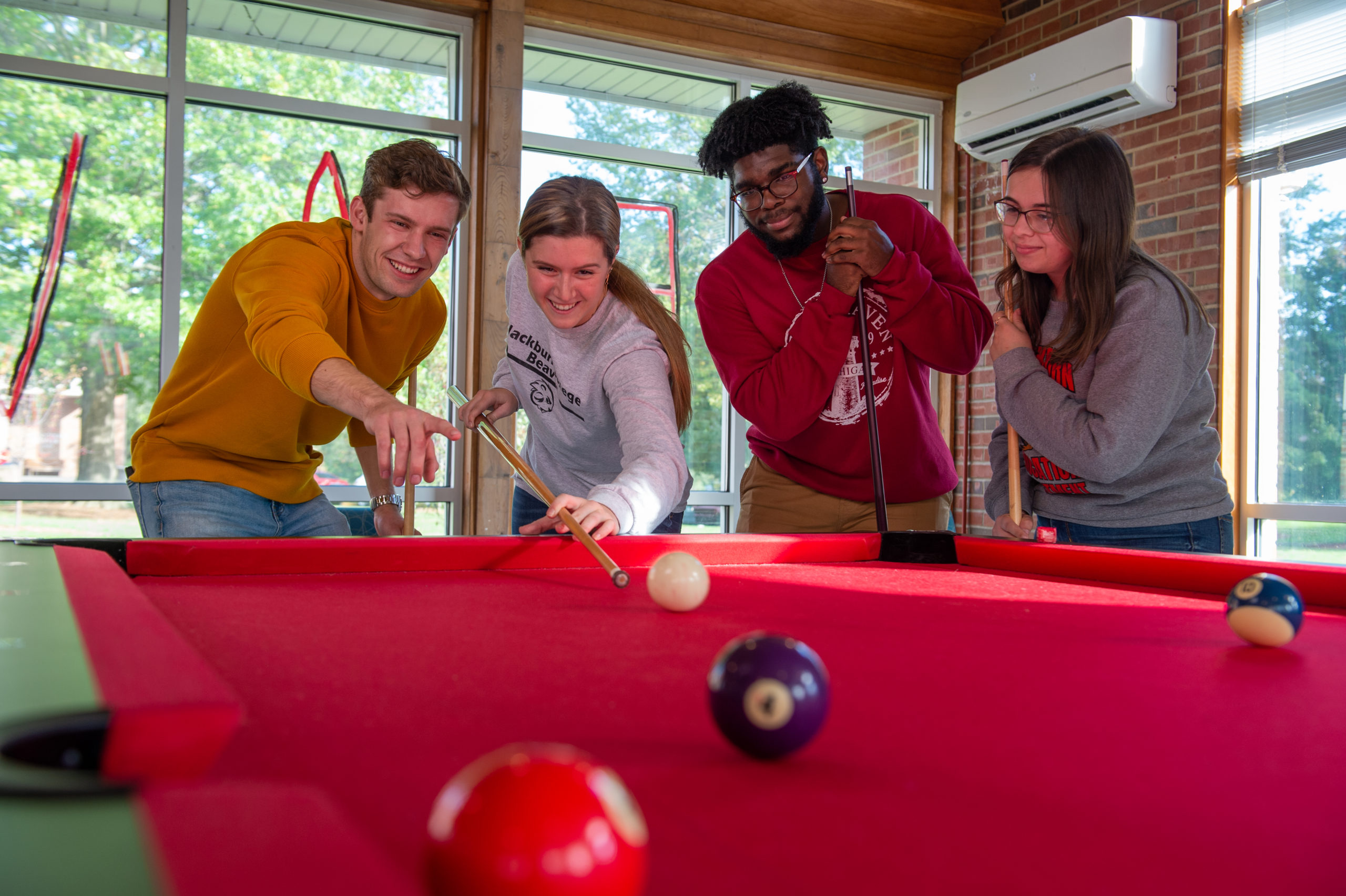 A group of students playing pool at North Hall.