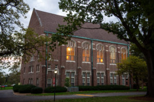 Wide view of Hudson Hall at night.