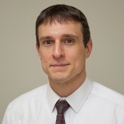 Jeremy McAninch smiling for headshot
