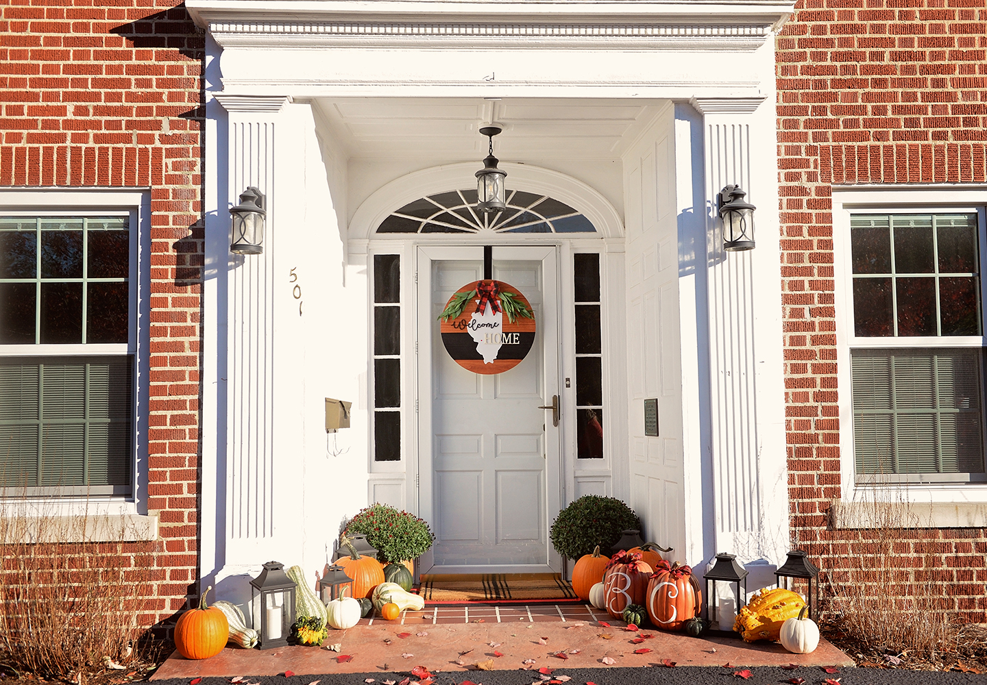 Shot of the entrance to the McKinley House. The front of the house is decorated with Fall themed ornaments and pumpkins.