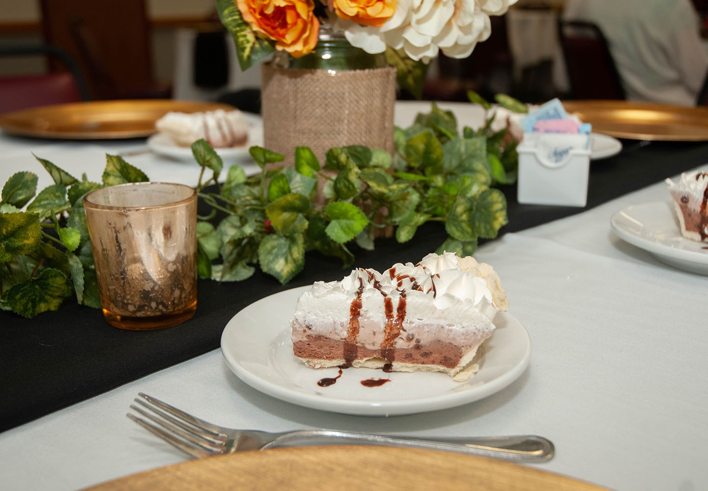 A slice of pie on the table of a catered luncheon for Homecoming at Blackburn College