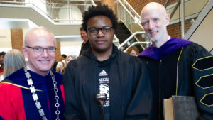 Senior Montreal Thomas was "tapped" as the new Student Marshal before his peers during Blackburn's All College Convocation signifying the beginning of a new academic year. Thomas is pictured with President Mark Biermann (left) and Al Sturgeon, Dean of Students and Head Cross Country Coach (right).