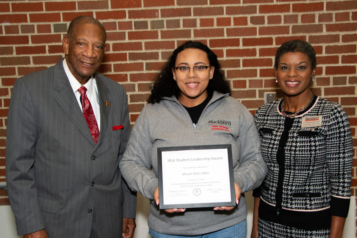 Blackburn student Miriam Wali-Uddin poses with her MLK Student Leadership Certificate between Dr. Leon Chestang (Blackburn alumnus and MLK Convocation Keynote Speaker) and Dr. Margaret Lawler (Executive Director of Diversity Equity and Inclusion)