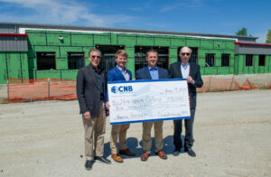 Pictured from left to right are Dr. Meyer, Matt Slightom, Dave Hurley, and Ed Lamar in front of the Blackburn Athletic Center to celebrate CNB's recent contribution of $10,000 to Winning Together, A Campaign for Athletics & Enrollment at Blackburn College.