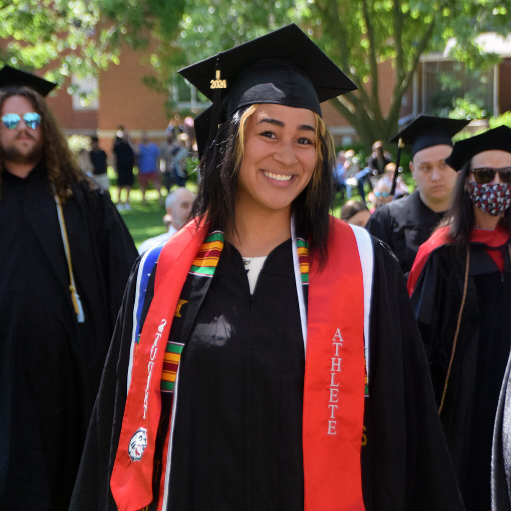 Jada Lurry, a Class of 2024 Senior Convocation speaker, pictured walking to the stage wearing cap and gown during commencement