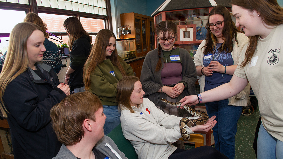 Student get up-close experience with a snake in Blackburn's vivarium