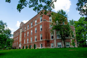 Stoddard Hall - brick exterior vantage point looking up on hill