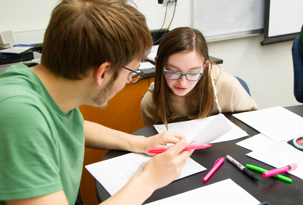 Student helps another student in science