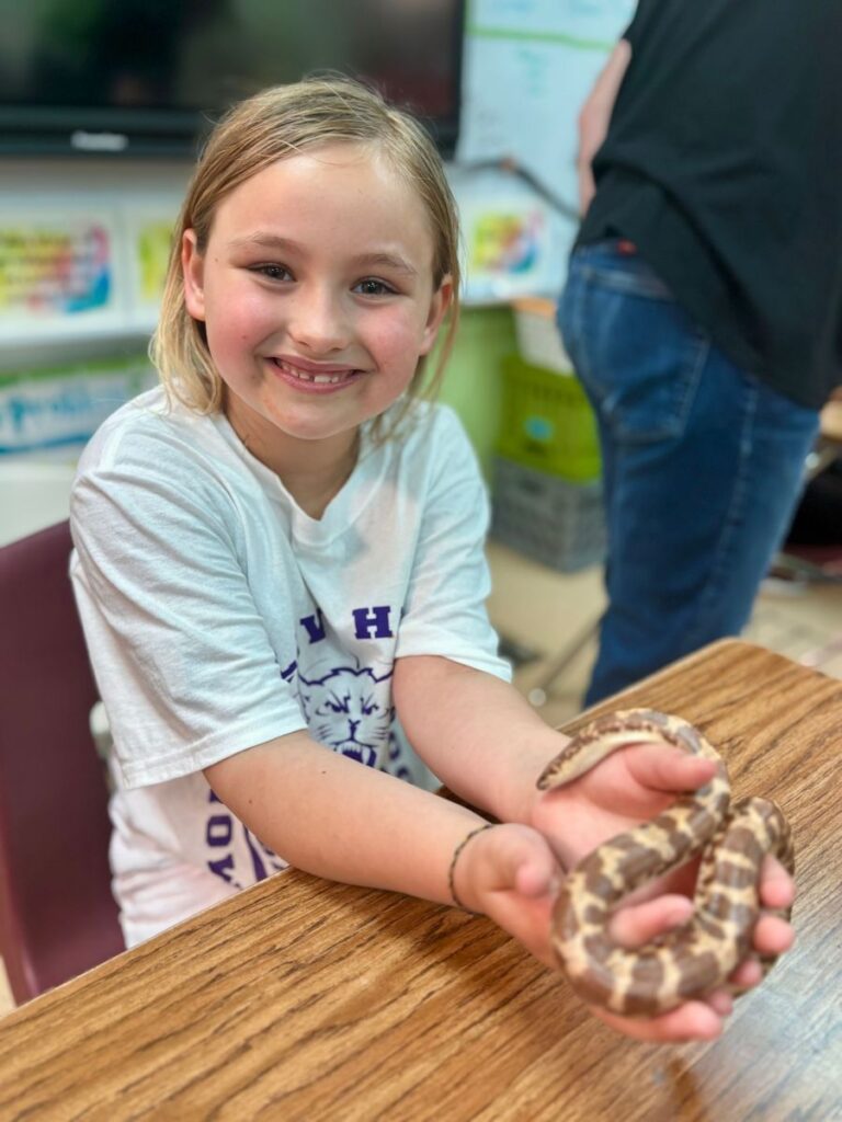 Mount Olive student holds snake