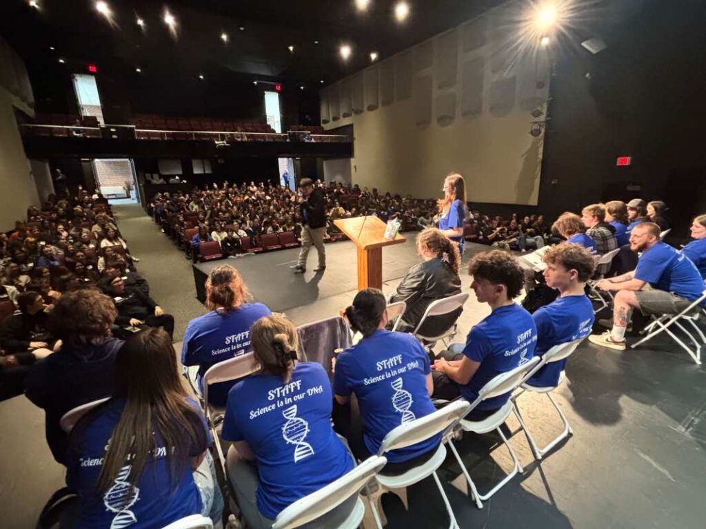 Blackburn students on the Bothwell Auditorium stage announcing awards during Science Day.