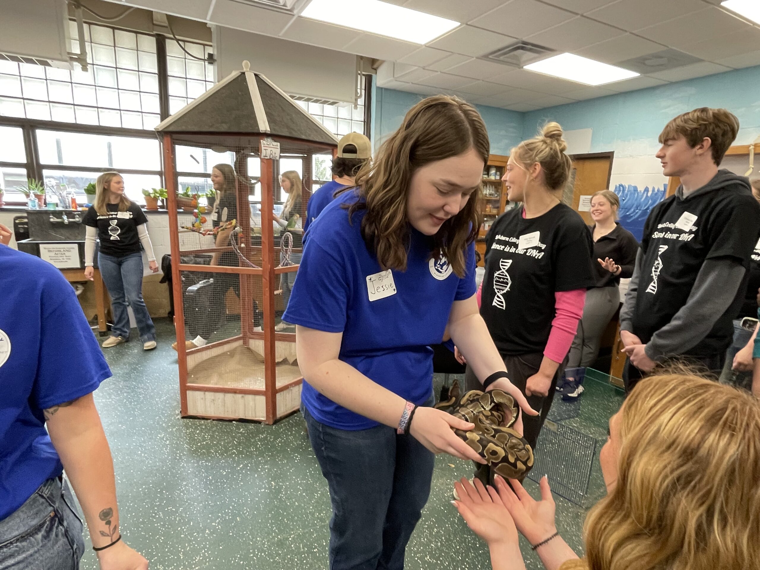 Blackburn student shows snake in crowded vivarium