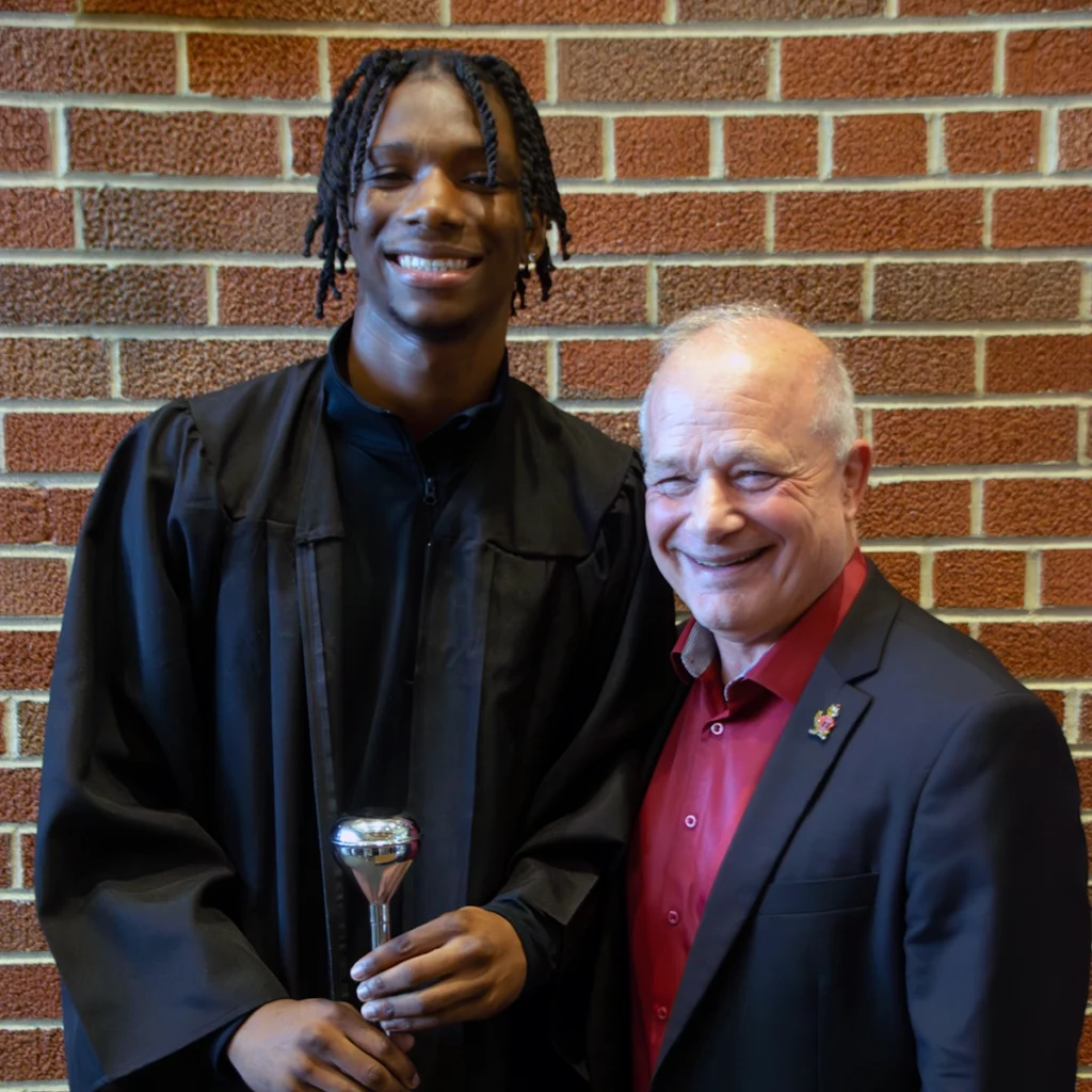 Darius Duff photographed with President Larry K. Lee following the ceremony where Duff was announced as Student Marshal.
