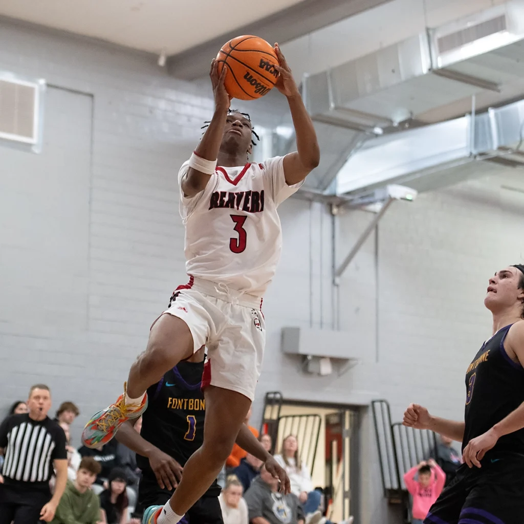 Duff drives to hoop as member of the men's basketball team during a game last year.