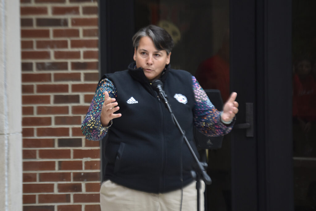 Director of Athletics Kim Camara-Harvey addresses crowd at Boente Family Plaza ceremony